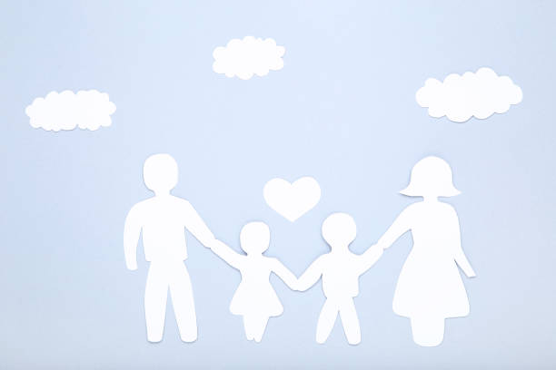 istock Paper family figures with clouds on gray background 1173284640