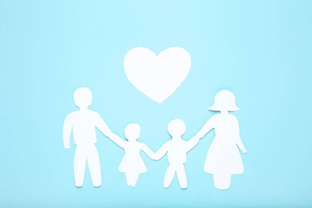istock Family figures with heart on blue background 1173284778
