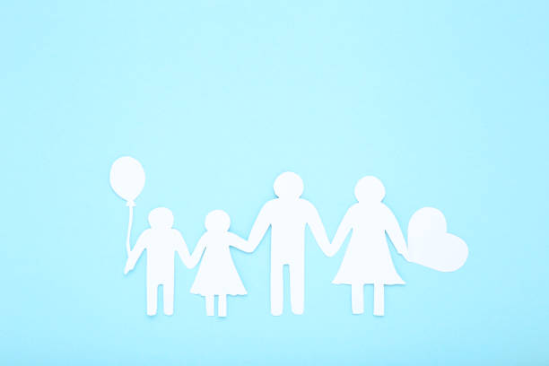 istock Family figures with heart on mint background 1173285827