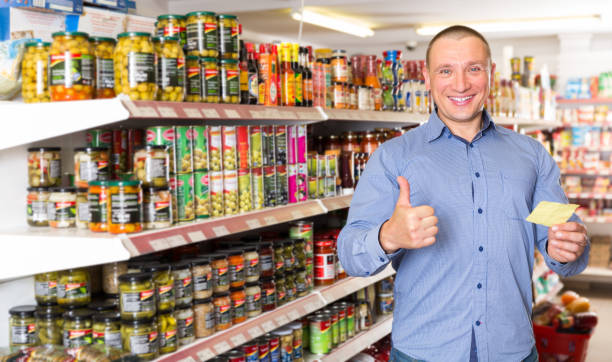 istock guy purchasing food products on shopping  list 1173290150