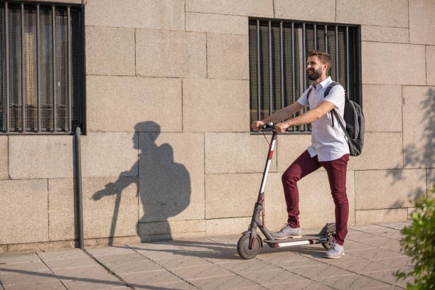 istock Young man with his scooter in the city 1173293955