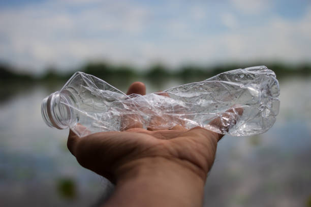 istock Hands are holding a plastic bottle that has been used 1173294168