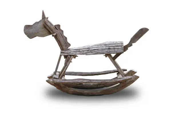 Photo of Rocking horse made of wood isolated on white background.