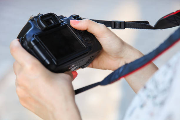 istock Girl photographer with reflex camera 1173294573