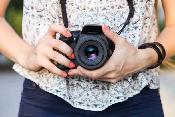 istock Girl photographer with reflex camera 1173294580