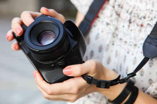 istock Girl photographer with reflex camera 1173294582