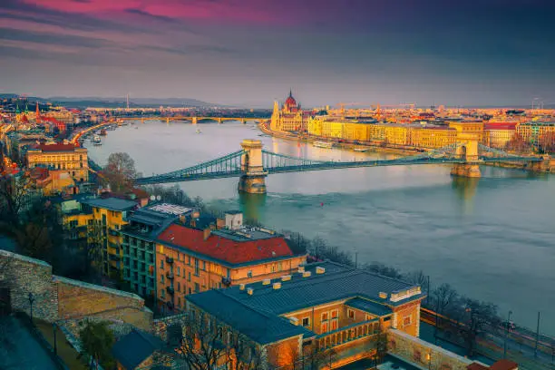 Photo of Majestic Chain bridge and Parliament building at sunset, Budapest, Hungary