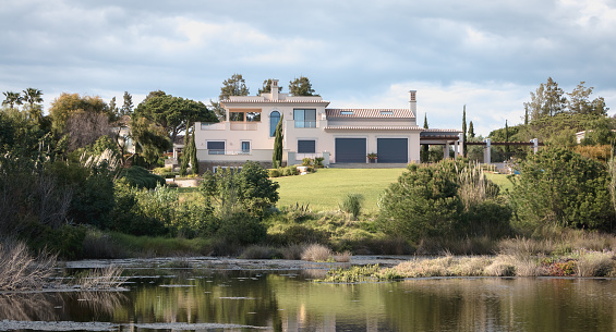 Quinta do Lago, Portugal - May 2, 2018: view of a luxury villa around the lake of Quinta do Lago on a spring day