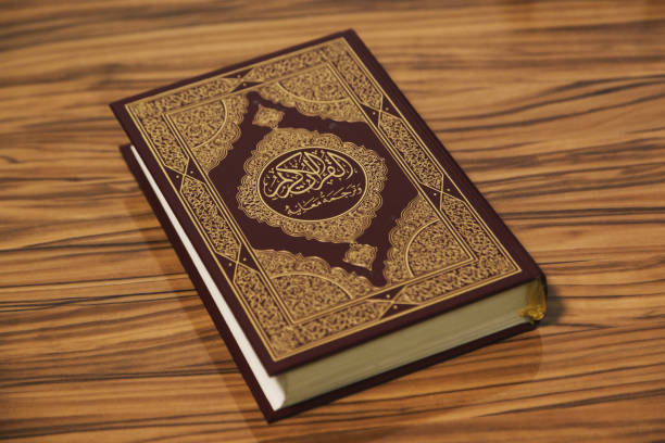 istock High Angle View Of Koran On Wooden Table 1173296963