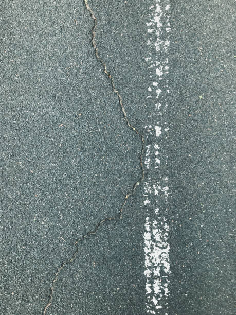istock Damaged asphalt street background with a white lane 1173297642