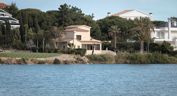Quinta do Lago, Portugal - May 2, 2018: view of a luxury villa around the lake of Quinta do Lago on a spring day