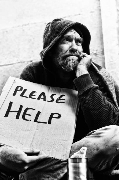 istock Desperate homeless man with sign 