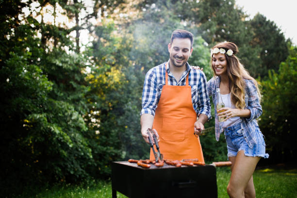 istock Friends having a barbecue party in nature 1173301597