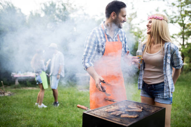 istock Group of friends making barbecue in the nature 1173301643