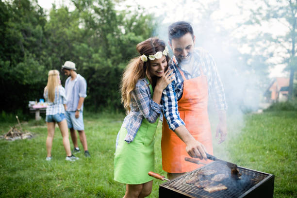 istock Friends having a barbecue party in nature 1173301661
