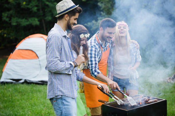 istock Friends having a barbecue party in nature 1173301711