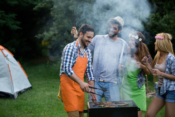 istock Friends having a barbecue party in nature 1173302249