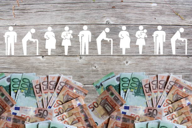 Weak social categories welfare concept with euro banknotes on wooden background stock photo