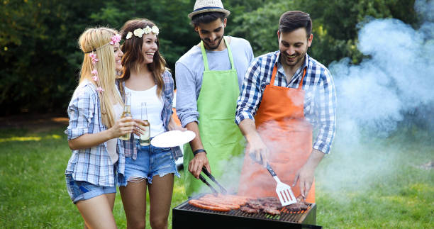 istock Happy people having camping and having bbq party 1173302990