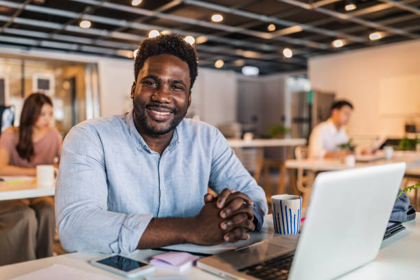 istock Handsome black gentleman in office 1173303132