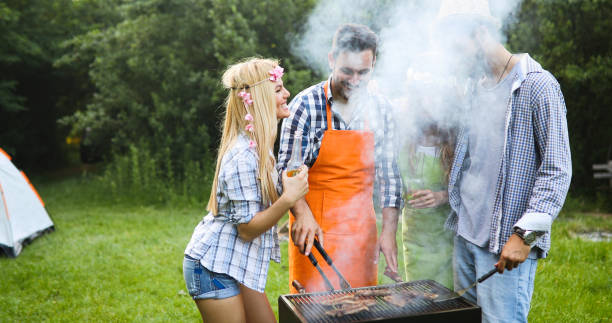 istock Friends making barbecue and having lunch 1173303224