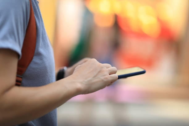 istock Hands pointing finger on smartphone screen at night 1173304306