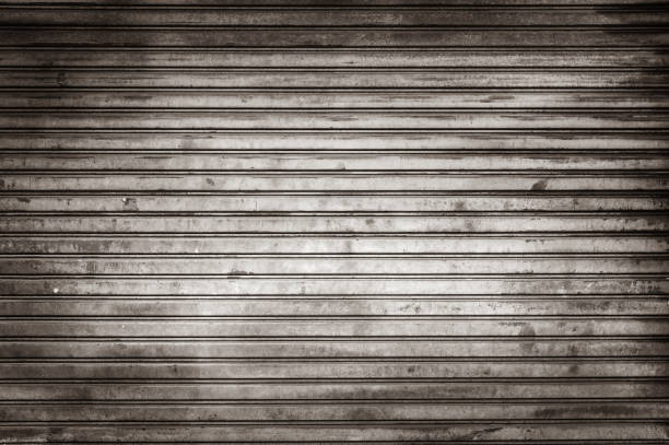 Old weathered and rusty steel door for steel metal backgroud and texture. Old weathered and rusty steel door for steel metal backgroud and texture. shutter door stock pictures, royalty-free photos & images