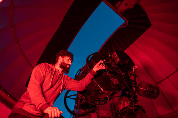 istock Astronomer in photo telescope dome 1173305683