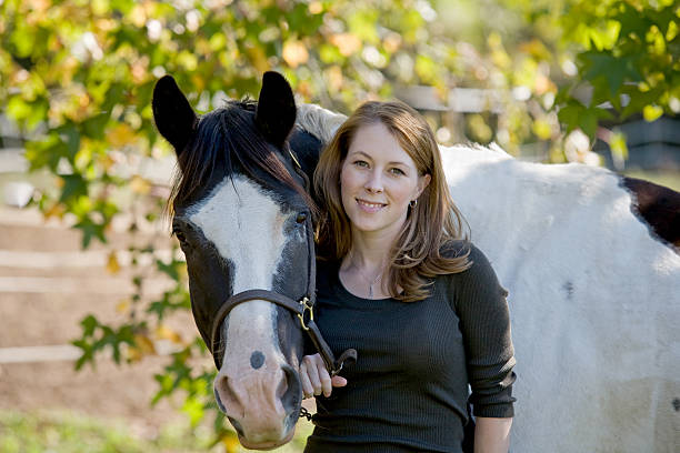 istock Woman Standing With Horse 117330962