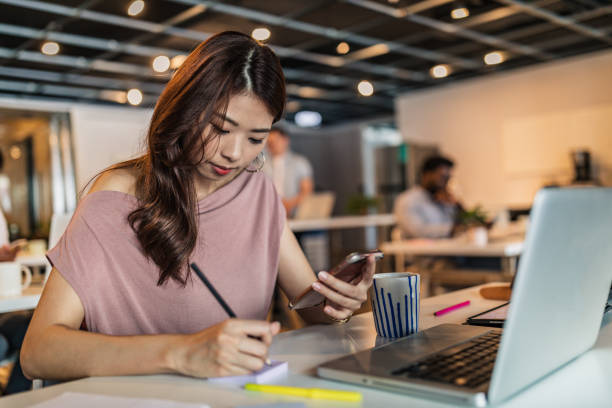 istock Beautiful woman working in modern office 1173314833