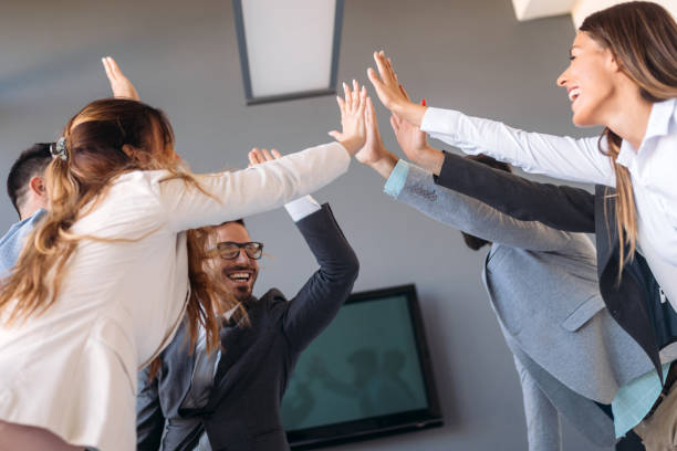 istock Business team celebrating a triumph with arms up 1173315988