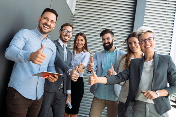 istock Business team celebrating a triumph with arms up 1173317873