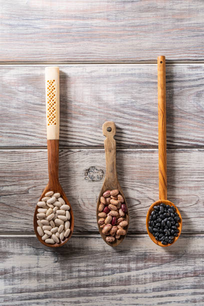 istock Dried beans legumes on wood spoon 1173318087