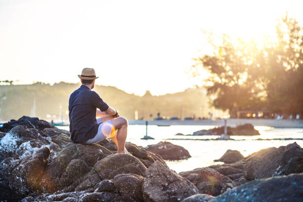 istock Sitting on the rocks near sea 1173319529