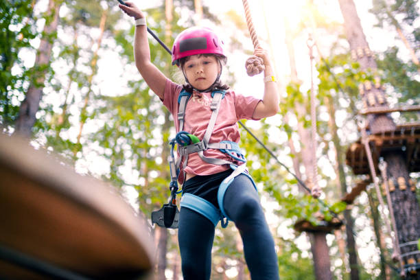 istock Girl overcomes obstacles in Adventure Rope Park 1173320689