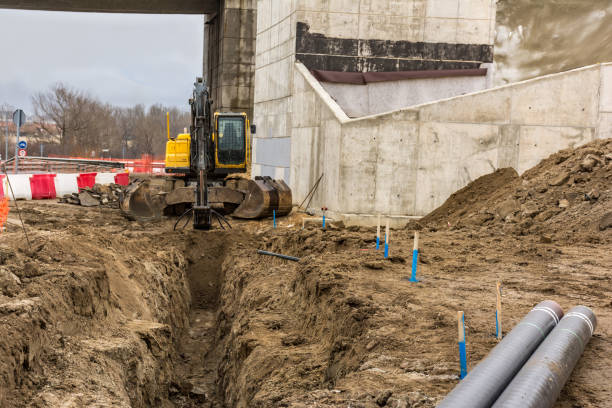 istock Machinery making a ditch to put pipes 1173322099