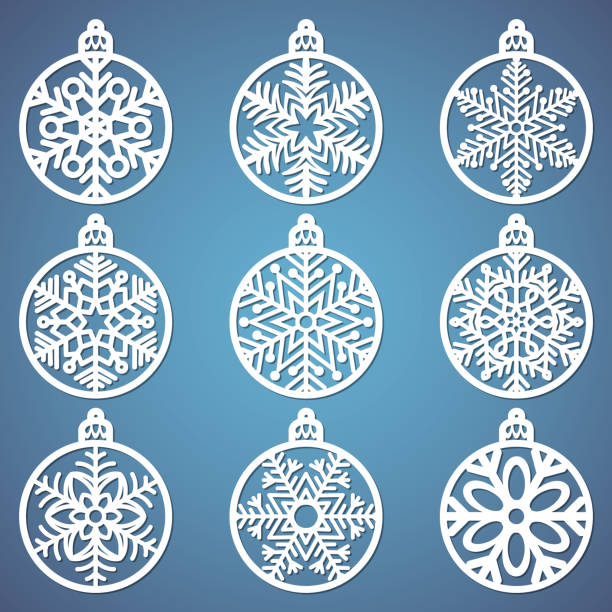 Christmas balls set with a snowflake cut out of paper. Templates for laser cutting, plotter cutting or printing. Festive background. Christmas balls set with a snowflake cut out of paper. Templates for laser cutting, plotter cutting or printing. Festive background. snowflake shape silhouettes stock illustrations