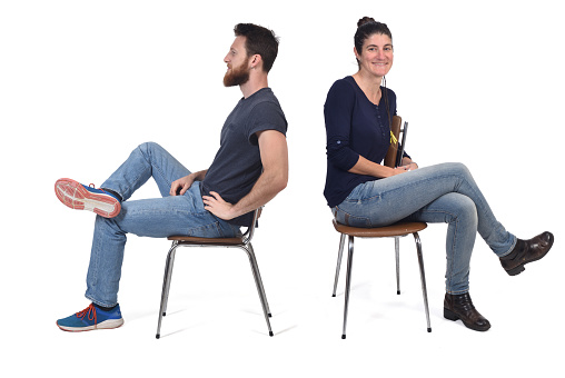 couple sitting in a vintage chair isolated on white