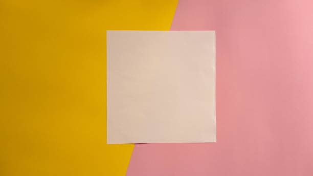 istock Notebook on Yellow and Pink Paper Background. Flat Design. Top View 1173327773