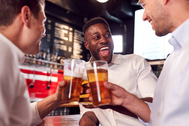 istock Three Men Making A Toast As They Meet For Drinks And Socialize In Bar After Work 1173327934