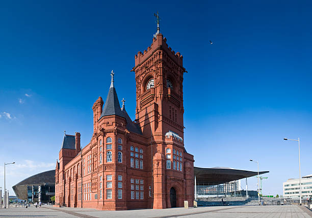 Cardiff views Pierhead building (1897) familiar landmark of the stunning Cardiff Bay. Millennium Centre and Welsh Assembly building behind. Perspective corrected stitched panorama detailed when viewed large. welsh culture stock pictures, royalty-free photos & images