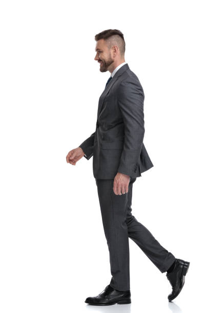 istock side view of a smiling businessman walking 1173332126