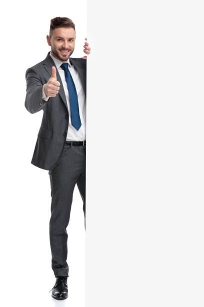 istock happy young businessman recommends with thumbs up a message 1173332704