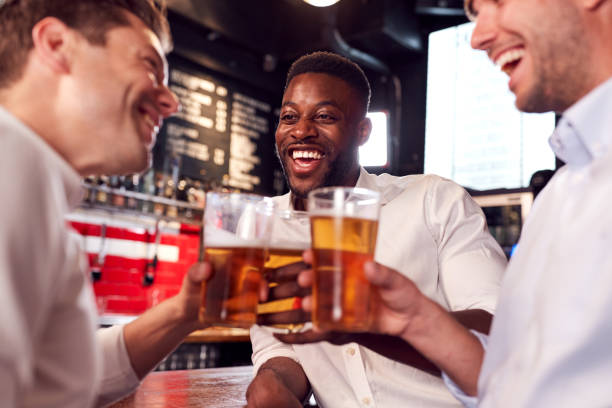 istock Three Men Making A Toast As They Meet For Drinks And Socialize In Bar After Work 1173332935