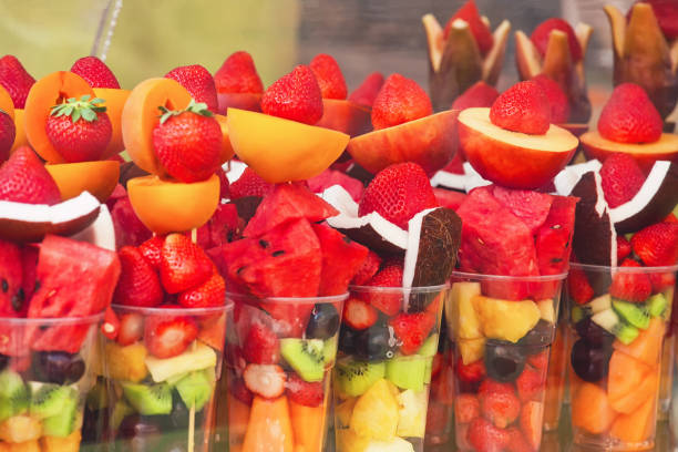 istock Fruit in plastic containers, street food background 1173334433