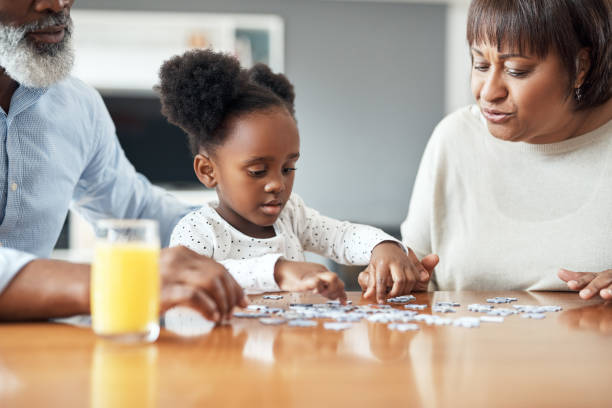 istock Puzzles provide the opportunity for children to develop fine motor skills 1173335627