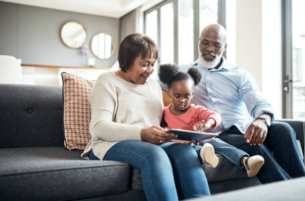 istock They don't mind watching her favourite cartoons with her 1173335649