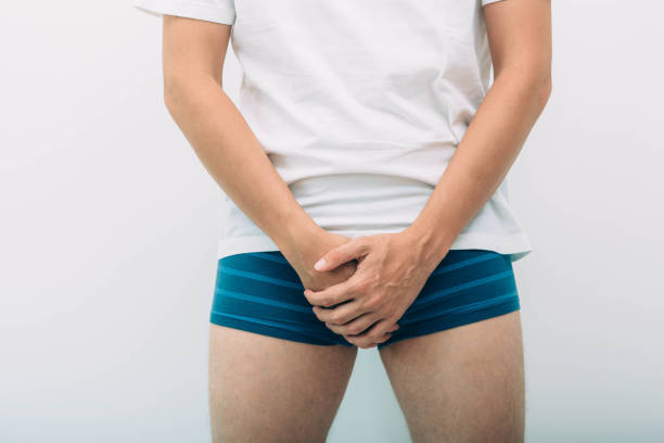 man wearing underpants holding genitals prostate problem. Men's health, venereologist, sexual disease man wearing underpants holding genitals prostate problem. Men's health, venereologist, sexual disease penis photos stock pictures, royalty-free photos & images