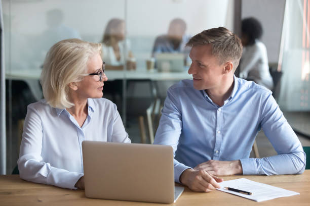 istock Diverse business partners discuss cooperation at meeting 1173335920