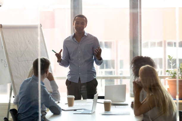 istock Black male coach make whiteboard presentation for employees 1173335955